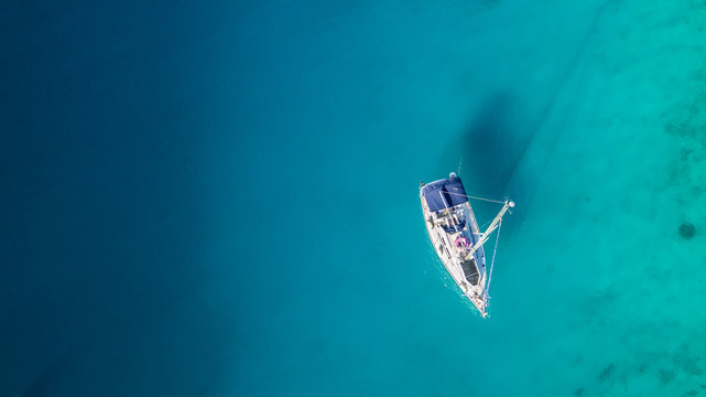 Sailing boat anchoring in Croatia bay, aerial view.