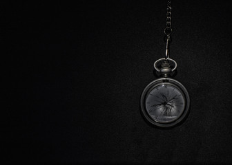 Fototapeta na wymiar Pocket watch with chain with black background.
