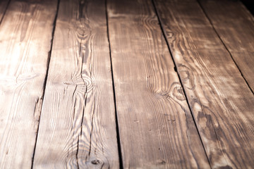 An old board with knots and chips. Wood. Background. Selective focus