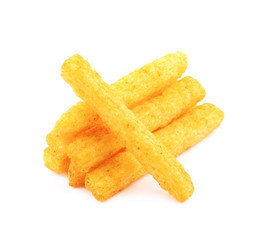 Pile of puffed cornmeal sticks isolated