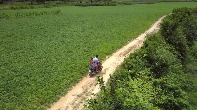 boundless peanut field and couple rides scooter