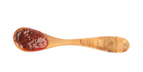 Wooden spoon of jam isolated