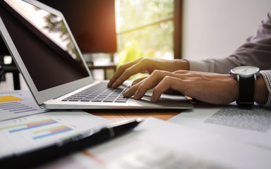 close up of businessman working on laptop do strategy to development profit.