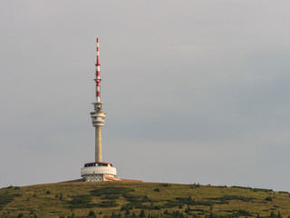 Praded hill in Jeseniky mountains with communication tower, mountain meadow