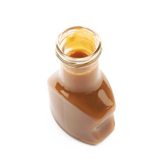 Bottle of caramel sauce isolated