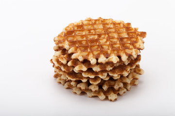 Stack of round waffles on white background