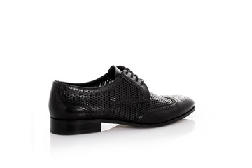 Close up of a black mens derby shoes on white background with reflection. Fashion advertising shoes photos.