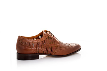 Close up of a brown mens derby shoes on white background with reflection. Fashion advertising shoes photos.
