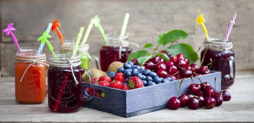 Homemade antioxidant summer fruits smoothie, berry juice assortment