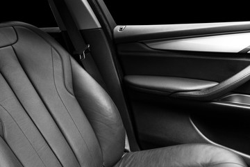 Modern Luxury car inside. Interior of prestige modern car. Comfortable leather Black seats. Black ...