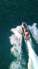 Aerial drone photo of Jet ski cruising in tropical waters