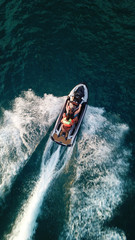 Aerial drone photo of Jet ski cruising in tropical waters