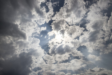 Summer sky with puffy dark clouds