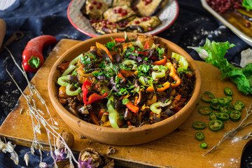 Ajapsandal vegetables stew in clay ketsi dish. Traditional Georgian food made cooked with different...