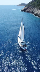Fotobehang Aerial drone birds eye view of sail boat cruising the Aegean sea, Greece © aerial-drone