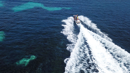 Top view of jet ski cruising in deep blue sea