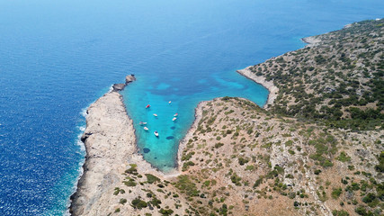 Aerial photo of tropical rocky seascape with beutiful turquoise clear sea and boats docked