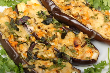 Stuffed eggplant with meat and vegetables with cheese, baked in the oven