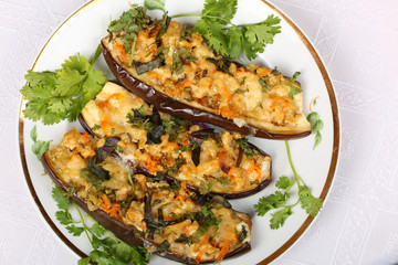 Stuffed eggplant with meat and vegetables with cheese, baked in the oven. Top view