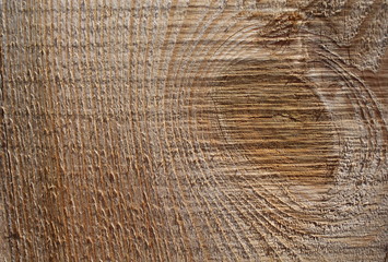 Background: an old pine board with knots, close-up.