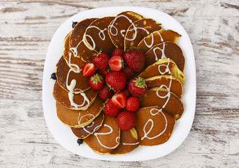  Pancakes with fruit. Breakfast with punkcakes. Pancakes in a pile on a plate.