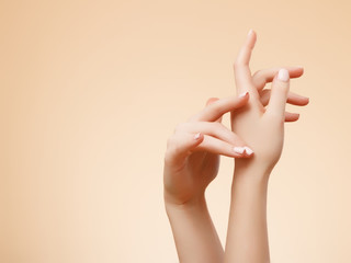 Beautiful Woman Hands. Female Hands Applying Cream, Lotion. Spa and Manicure concept. Female hands...
