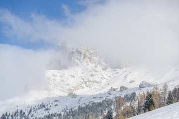 Fototapeta na wymiar Dolomites Mountains in the clouds