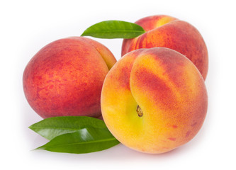 Fresh peaches on white background