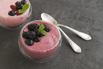 Berry natural yogurt in a glass bowl.