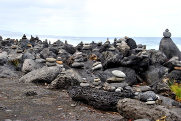 Reunion island seascape, landscape. Black sand, volcanic rocks.