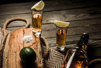 Obraz na płótnie Canvas Tequila stack on a wooden background
