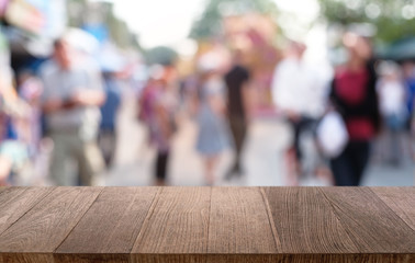 Empty dark wooden table in front of abstract blurred bokeh background of restaurant . can be used for display or montage your products.Mock up for space.