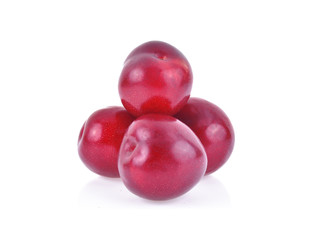 red cherry plums isolated on white background