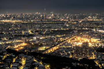 Fototapeta na wymiar Aerial night view of Taipei City from Datongshan Mountain in Shulin, Taiwan.