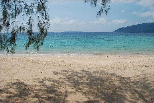 Sandy beach with turquoise sea of Tekek village on Tioman island, Malaysia