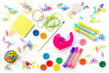 Background of colorful school supplies  isolated on white. Back to school concept