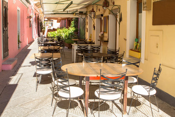 Street cafe in La Maddalena Port, Italy