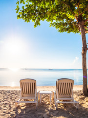 Empty chair on the tropical beach sea and ocean
