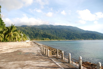 Fototapeta premium Walk along embankment of Tekek, the central village of Tioman island, Malaysia