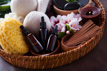 spa setting with hibiscus flowers on brown