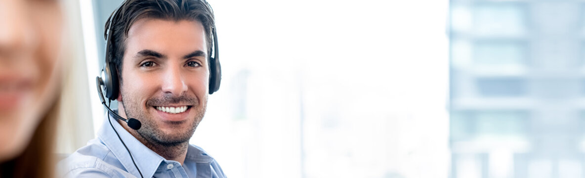 Smiling Friendly Hispanic Man Working In Call Center