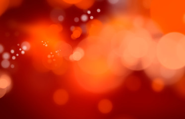 An abstract illustrated red, orange and yellow warm bokeh background.