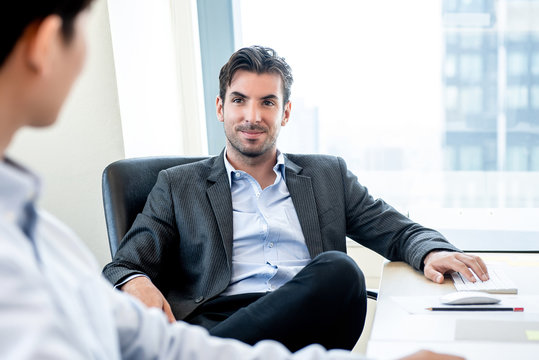 Handsome Hispanic Businessman As A Boss Sitting In The Office