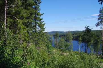 Scenic lake in Dalarna on a sunny and warm summer day