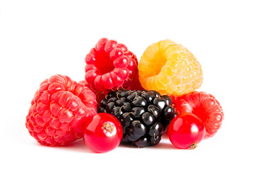Big Pile of Fresh Berries on the White Background. Ripe Sweet Raspberry, Blackberry, Currants