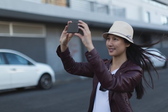 Woman Taking Photo With Mobile Phone