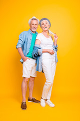 Full length size vertical photo portrait of beautiful handsome excited carefree modern trendy fashionable cool people model in casual outfit standing waiting for weekend isolated on bright background