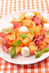 melon salad with ham, mozzarella and basil