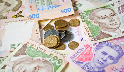 ukrainian coins on paper money background