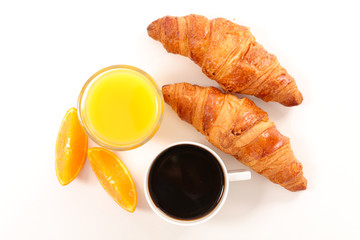 coffee cup, orange juice and croissant